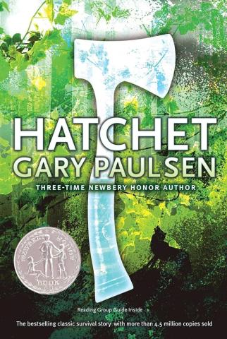 green forest background. shape of a hatchet on top, with blue sky and clouds in the middle of the hatchet. The title and author name on top in white text--Hatchet by Gary Paulsen. Silver "Newberry Honor Book" Award in the bottom left corner